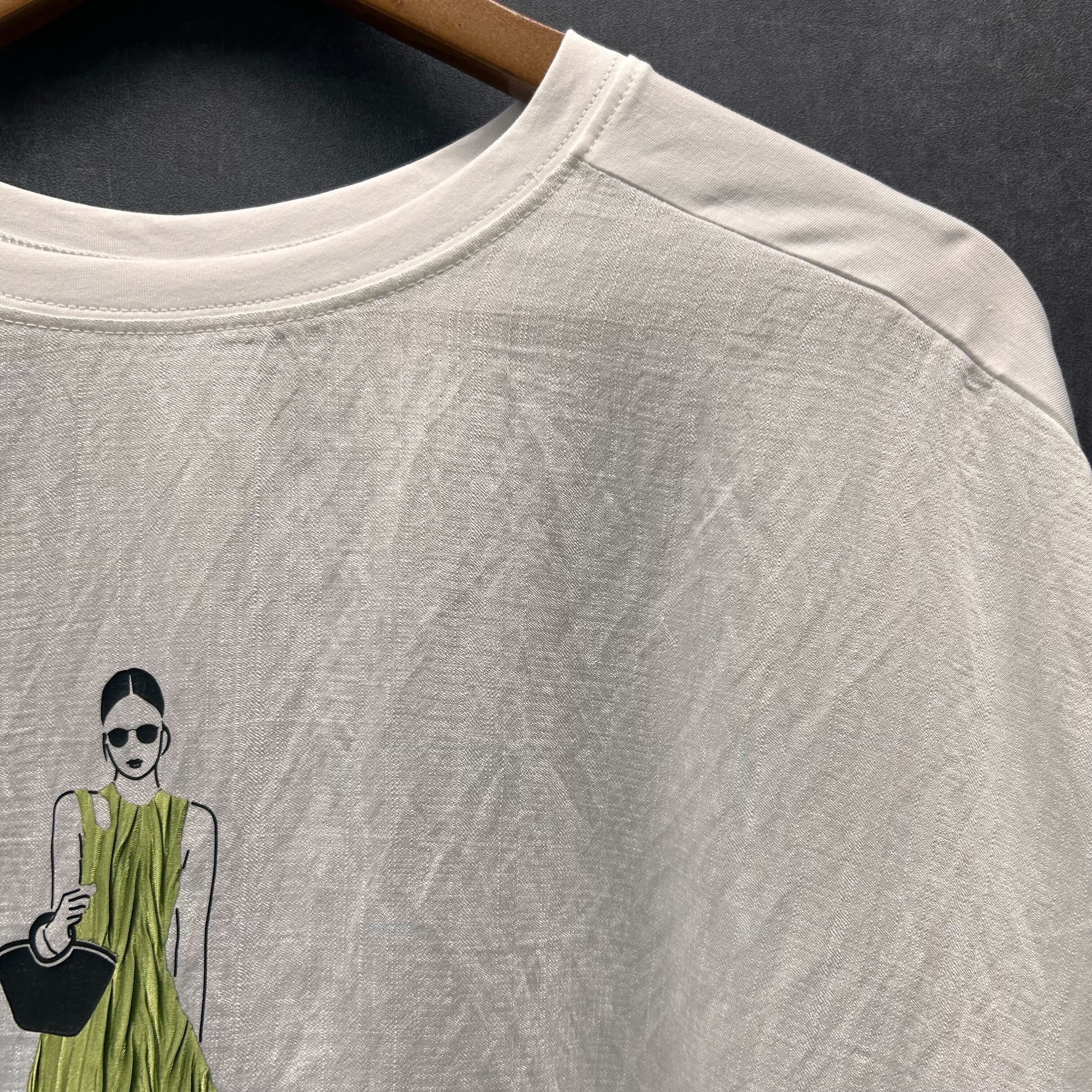 ウーマングラフィックTシャツ アイボリー※4/23~29までに順次配送予定